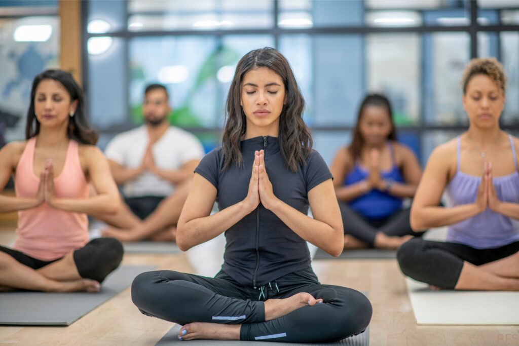 Woman seated in a yoga meditation pose